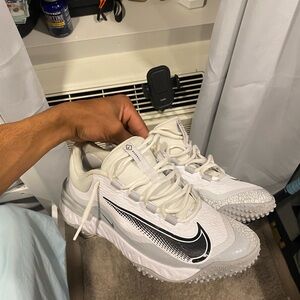White and Gray Athletic Shoes with Black Swoosh